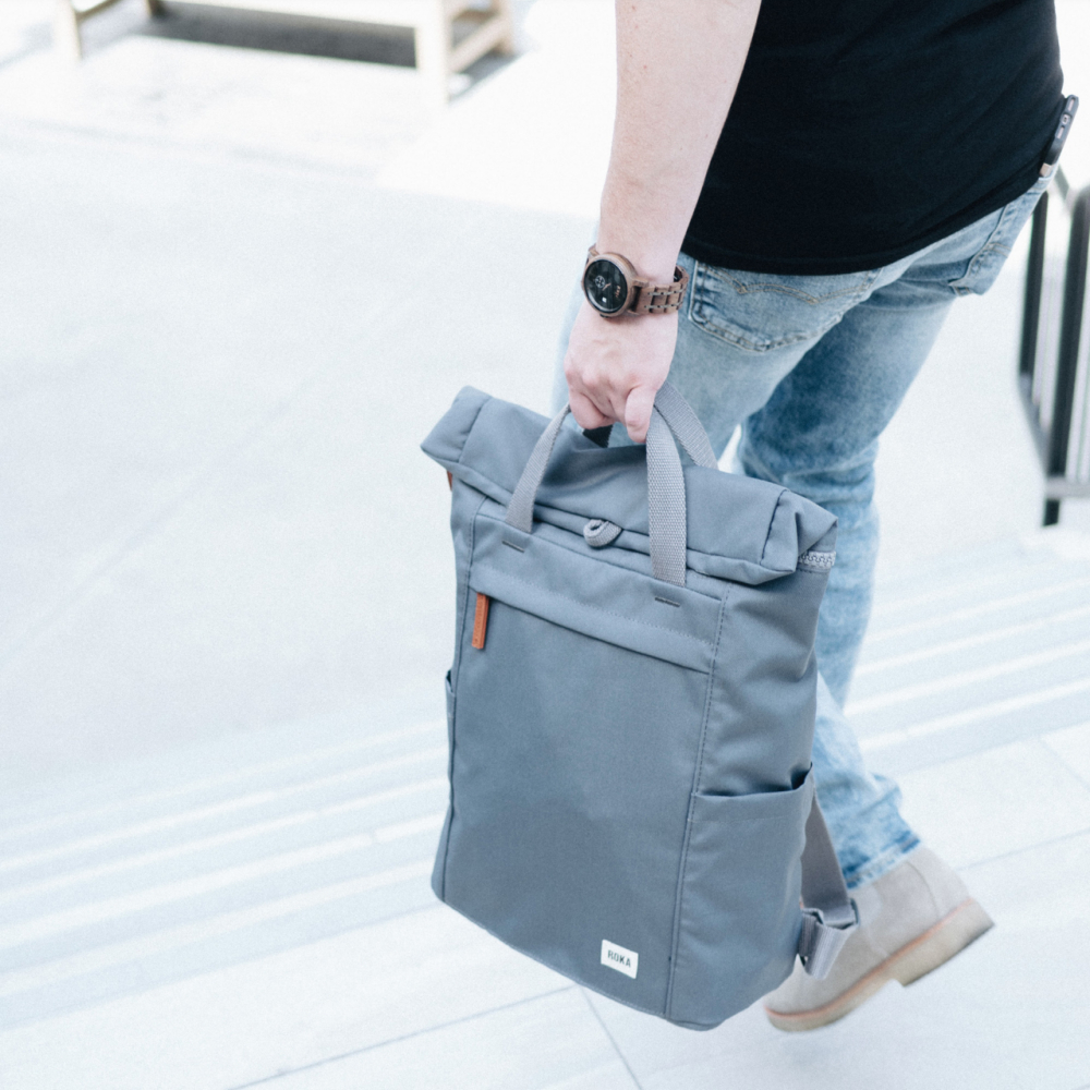 roka finchley sustainable medium backpack held by handles